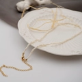 Mini collana di perle d'acqua dolce con chiusura dorata e catena regolabile - Perla piatta