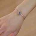 Natural aquamarine bracelet with silver bamboo chain shown on a woman wrist - Aquamarine (Bamboo Joint Bracelet)