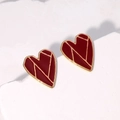 Minimalist red heart stud earrings with 18K gold plating on white marble surface - Burgundy