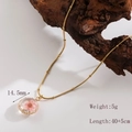 Vintage gold-toned titanium steel necklace featuring a dried pink flower pendant - |round-light Pink