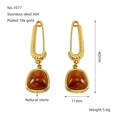 Macro detail of paperclip earrings with amber natural stone and 18k gold plating - Vintage Pin Amber (No.1077)