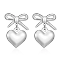 Polished silver bow and 3D heart earrings with elegant metallic luster on white background - Silver Bow And Heart Style