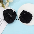 Detail of black elastic hair scrunchie with attached protective fabric cup cover pouch - Black