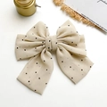 Barrette nœud beige à pois noirs pour femme sur fond blanc épuré et minimaliste - Blanc Cassé à Pois