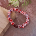 Detail of beaded bracelet with red blue marbled beads and a brown football charm - 10mm Red Football