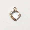 Close-up of a heart-shaped birthstone pendant with golden frame and clear crystal inlay - Gold-April