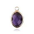 Detail of faceted oval purple glass pendant with golden metal border and jump ring - Gold - February