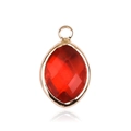 Macro shot of a marquise cut red crystal pendant with a gold plated bezel and bail - Gold - July
