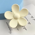 Detail of a matte cream flower hair claw clip displayed on a blue geometric prop - Large Flower Style / White
