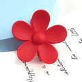 Close-up of a matte red five-petal flower hair claw clip with a round center design - Large Flower Style / Red