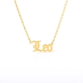Detailed view of Leo zodiac pendant necklace in vintage gold gothic style lettering - Leo (Gold)