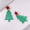 Detail view of festive green glitter Christmas tree earrings with red star top decor - Acrylic Christmas Tree