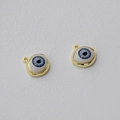 Close-up of golden evil eye pendants with blue and white details for jewelry making - KC Gold (Blue Eye)