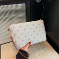 Woven daisy print clutch bag in beige cotton linen with a brown leather wristlet strap - Blue Floral / Blue