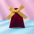 Red velvet gift pouch featuring a bright gold silk ribbon bow for jewelry packaging - Burgundy And Gold Ribbon; 10*12