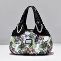 Floral patterned tote bag with black glossy handles and a silver metal logo plate - Black Dreamy Green Flower