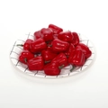 Miniature artificial red chili pepper props displayed in a grid pattern paper plate - Mini Red Bell Pepper