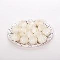 Set of 12 glossy white artificial mini garlic props for decoration on a grid tray - Mini Garlic