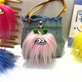 Detailed view of colorful plush monster charms with large eyes and fuzzy textures - Single Piece / Pink