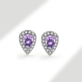 Macro detail of pear-cut purple gemstone earrings with silver halo and small white crystals - 925 Silver / Alexandrite Purple (June)