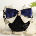 Close-up of a navy bow hair net clip with gold trim and crystal floral ornament - Willow Leaf Gold Edge Beige + Blue