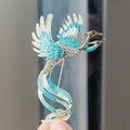 Squisita spilla a fenice con smalto blu e strass scintillanti su base in metallo dorato - Blu (XZ0301-2)