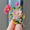 Chic enamel flower brooch featuring pink dahlia and white daisy with gold leaf details - Three Daisies Pink