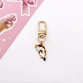 Detailed view of the calico cat enamel charm with a golden D-ring clasp for keychains - Calico Cat