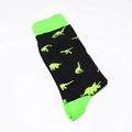 Detail of cotton crew socks featuring green dinosaur patterns and neon accents on black fabric - One Size / Dinosaur Silhouette (A161)