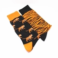 Detail view of cotton mid-calf socks with asymmetrical orange tiger patterns and stripes - Little Tiger Stripes