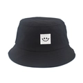 Detail of a black cotton bucket hat featuring a white square smiley face patch on the front - M (56-58cm) / Black (Smile Face Patch)