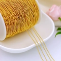 Close-up of bulk 18K gold plated bead chain roll for DIY jewelry making and necklaces - 1.5mm Bead Chain / Thick Silver
