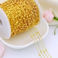 Detail of 18K gold-plated brass bead chain wrapped on a spool for DIY jewelry making - Big Beaded Chain / Thick Silver