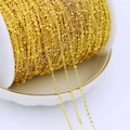 Macro shot of 18K gold plated copper chain on a white spool for DIY jewelry making - Small Beaded Chain-B / Thick Silver