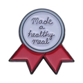 Round enamel medal brooch featuring 'Made a healthy meal' text and red ribbon detail - Healthy Meal Style (xz8872)