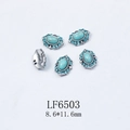 Detailed macro view of vintage silver nail charms with turquoise stone and blue rhinestones - Turquoise Cabochon Blue Rhinestone Alloy Charm (6503)