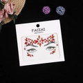 Detailed view of red and orange facial rhinestone stickers for forehead and eyes decoration - Red Gold/Aurora Red