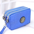Blue nylon wristlet bag featuring three zipper compartments and a durable strap - Medium / Sapphire Blue