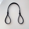 Detail shot of the durable black faux leather handle with secure metal buckle fasteners - Bag Extension Shoulder Strap (Strap Only)