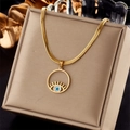 Detailed view of gold evil eye pendant with blue eye element on flat snake bone chain - Evil Eye Snake Chain Style (N1919)