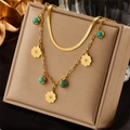 Gold double-layered snake chain necklace with turquoise and flower charms on beige pad - Double Layer Flower Turquoise Pendant Necklace (N1759)