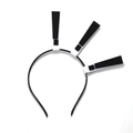 Detail view of a black Halloween headband featuring three black and white exclamation marks - Black Exclamation Mark