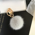 Detailed view of soft gray fur ball keychain with high-quality gold metal hardware hooks - Light Gray