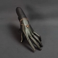 Rose gold interlocking double ring bracelet displayed on a matte black hand model - Black