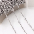 Close-up of silver-plated coffee bean pig nose metal chain link for DIY jewelry making - 4.5*6.5mm / White Gold