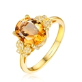 Elegante anillo chapado en oro 18k con gran gema amarilla y detalles florales laterales - Anillo