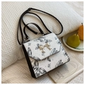 White butterfly pattern handbag with silver bow metal clasp and black handle - Black