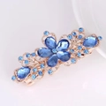 Haarklammer Blume in Gold mit blauen Strasssteinen und elegantem Filigran-Design - Hellblau