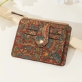 Detail view of ethnic mandala print cork wallet with card slots and metal zipper - Crossed