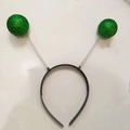 Cerchietto con antenne a sfere verdi glitterate con telaio nero e molle - Trifoglio glitterato verde